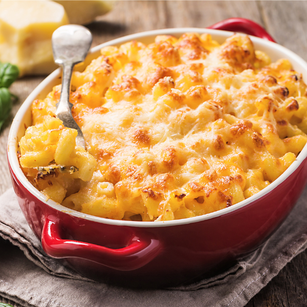 Serving dish filled with creamy mac and cheese topped with toasted breadcrumbs