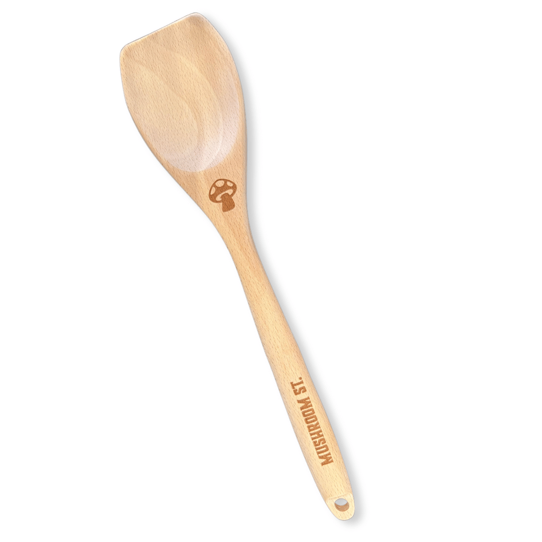 Wooden spoon branded with Mushroom Street logo